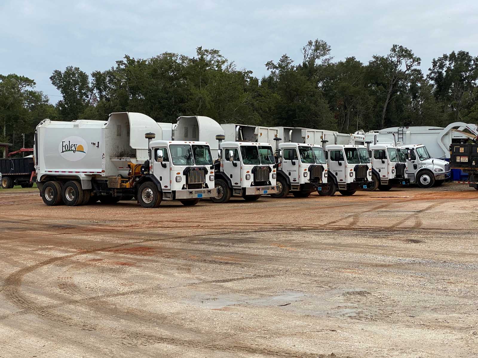 Foley Adding Two Garbage Trucks