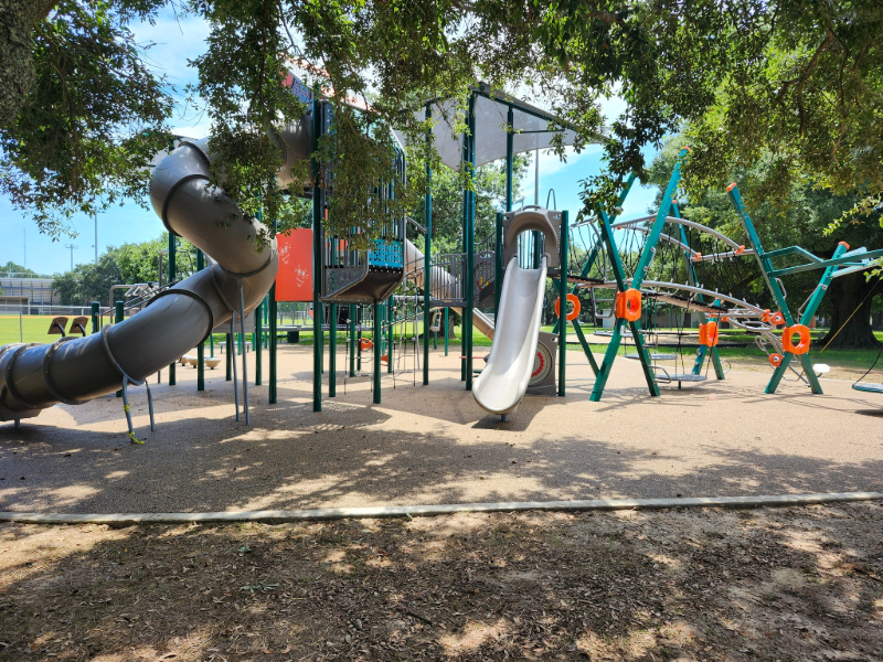 MOBILE CUTS RIBBON ON FIGURES PARK PLAYGROUND