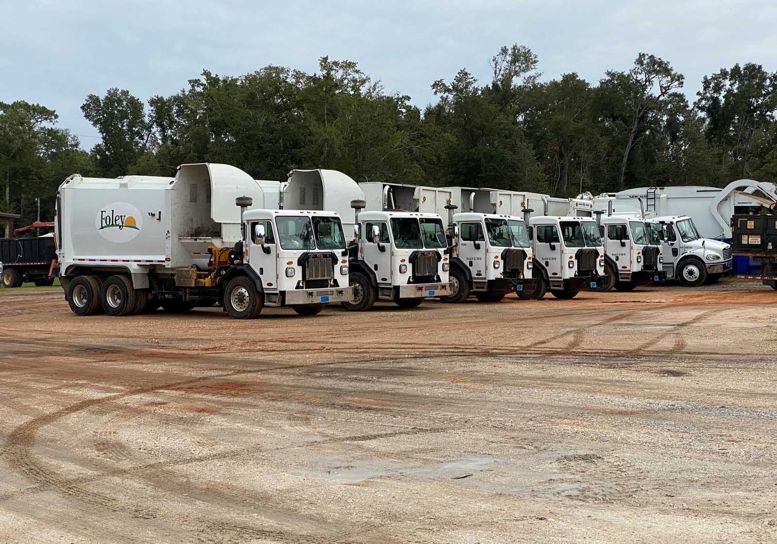 Foley Adding Two Garbage Trucks